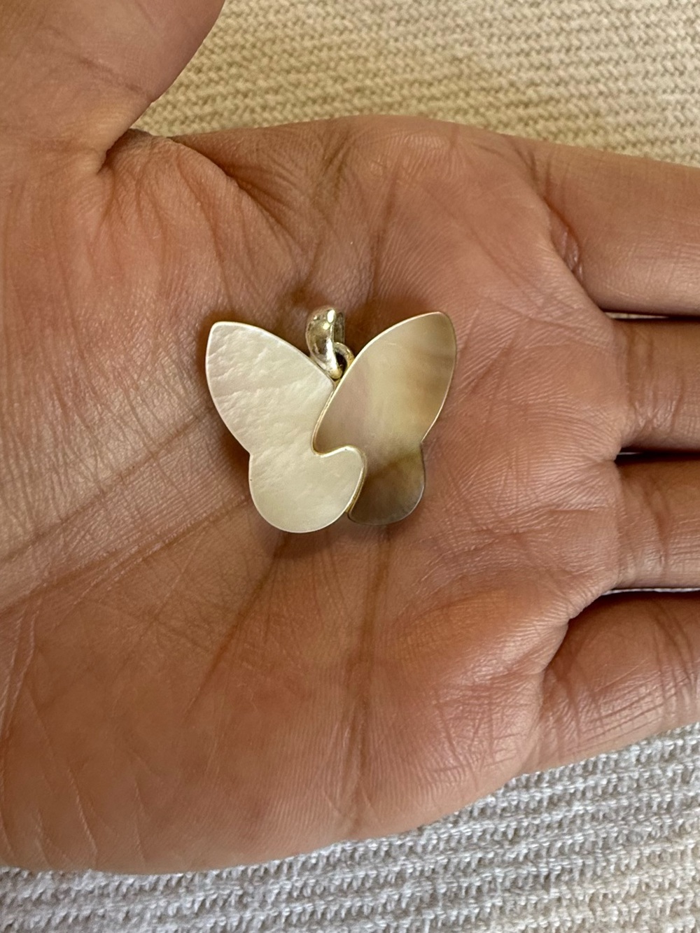 Vintage Avon silver-tone mother-of-pearl layered butterfly pendant.